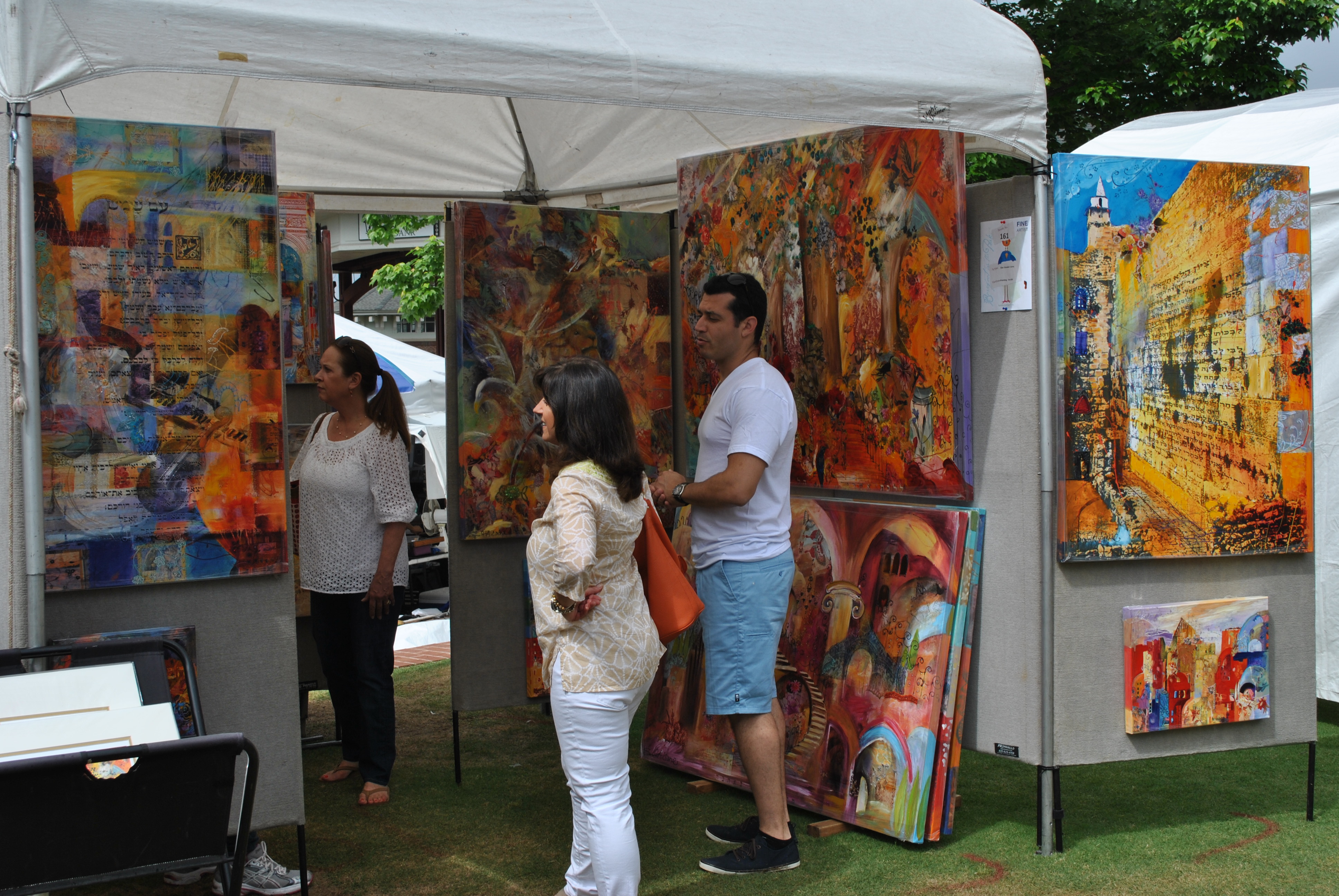 Barefoot in the Park Attendees Visiting an Artist's Booth