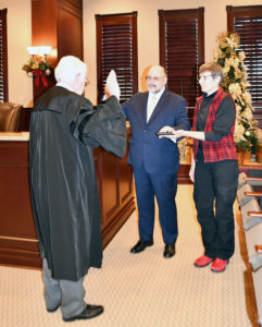 Manfred Graeder being sworn into office by Judge Charles Barrett.