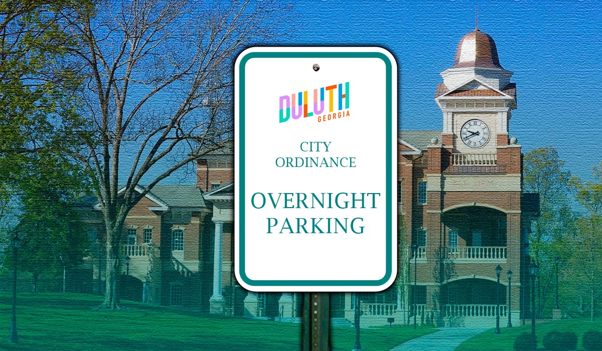 Image of a parking sign that says "City Oridnance Overnight Parking"